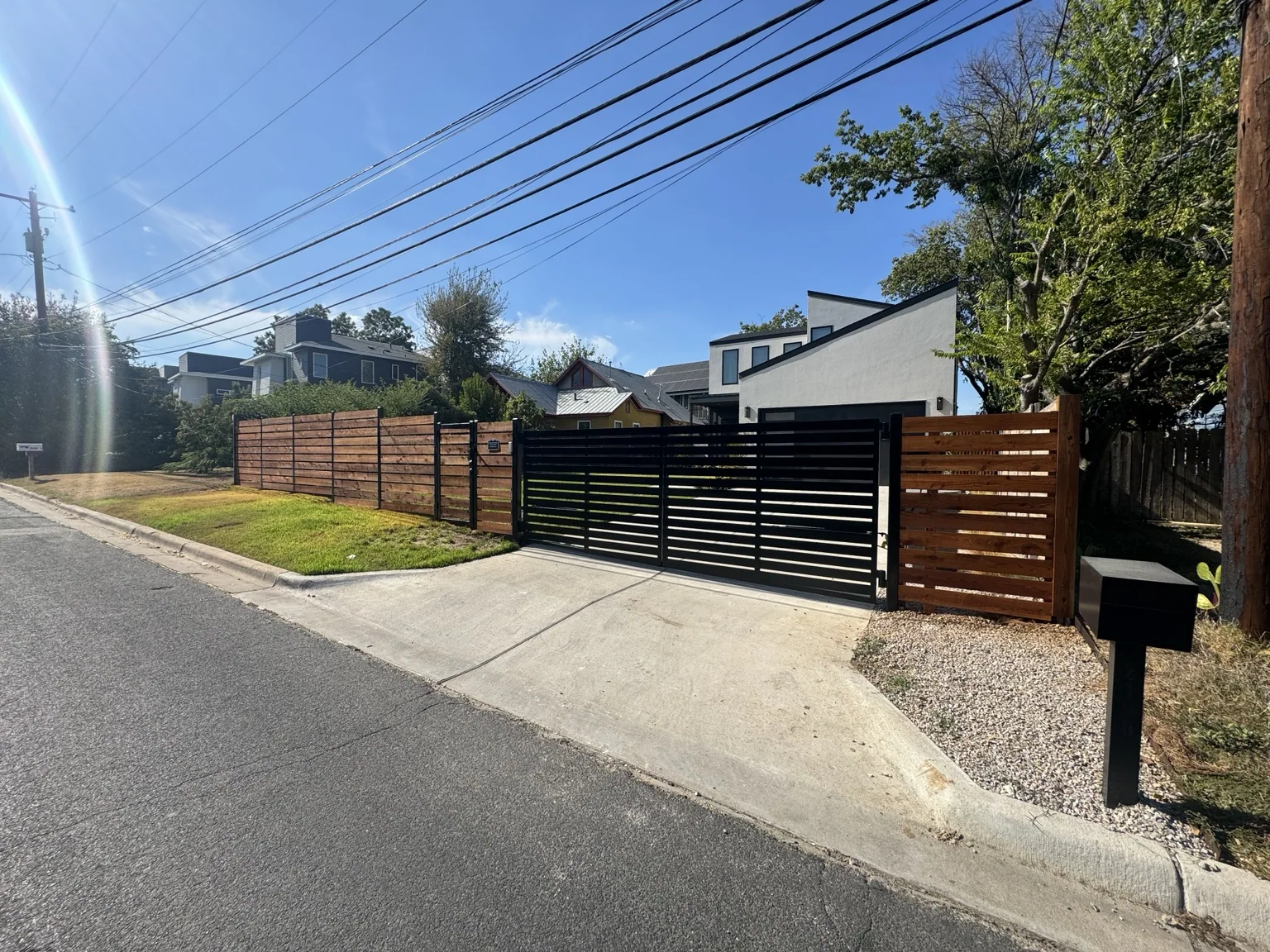 Contemporary driveway gate and fencing